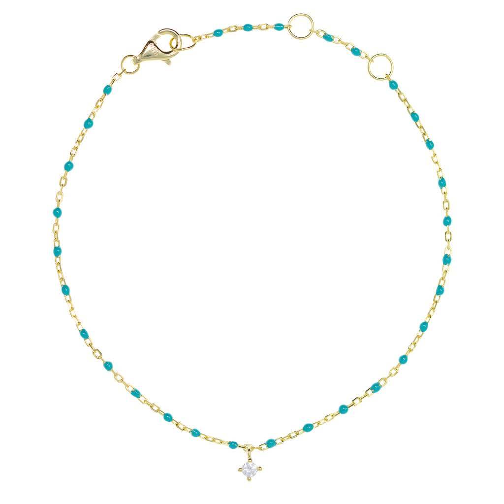 Turquoise bead and gold chain bracelet with hanging CZ.