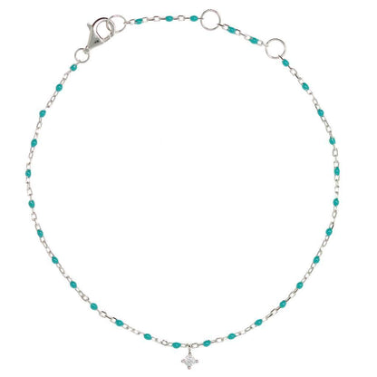 Turquoise bead and silver chain bracelet with hanging CZ.