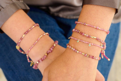 Meadow Gold & Pink Tourmaline Beaded Slider Bracelet worn with other  Pink Tourmaline bracelets in the collection.