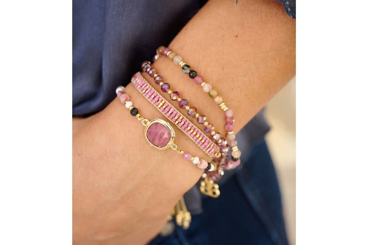 Adria Gold Beaded Pink Tourmaline Bracelet worn in a stack with other bracelets 