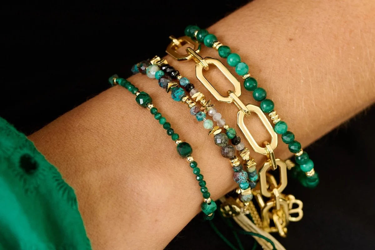 Meadow Gold & Malachite Beaded Slider Bracelet worn other bracelets in the collection.