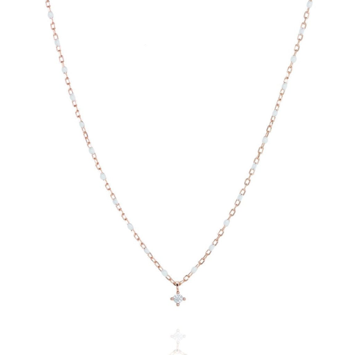 Short rosegold chain and bead necklace. White bead, small cubic zirconia at a central point on the necklace.