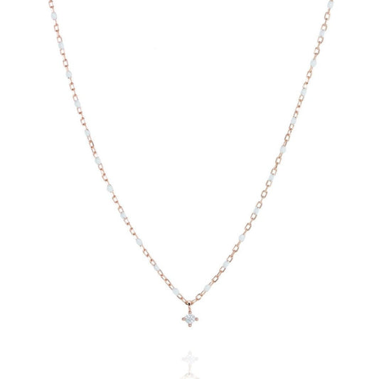 Short rosegold chain and bead necklace. White bead, small cubic zirconia at a central point on the necklace.