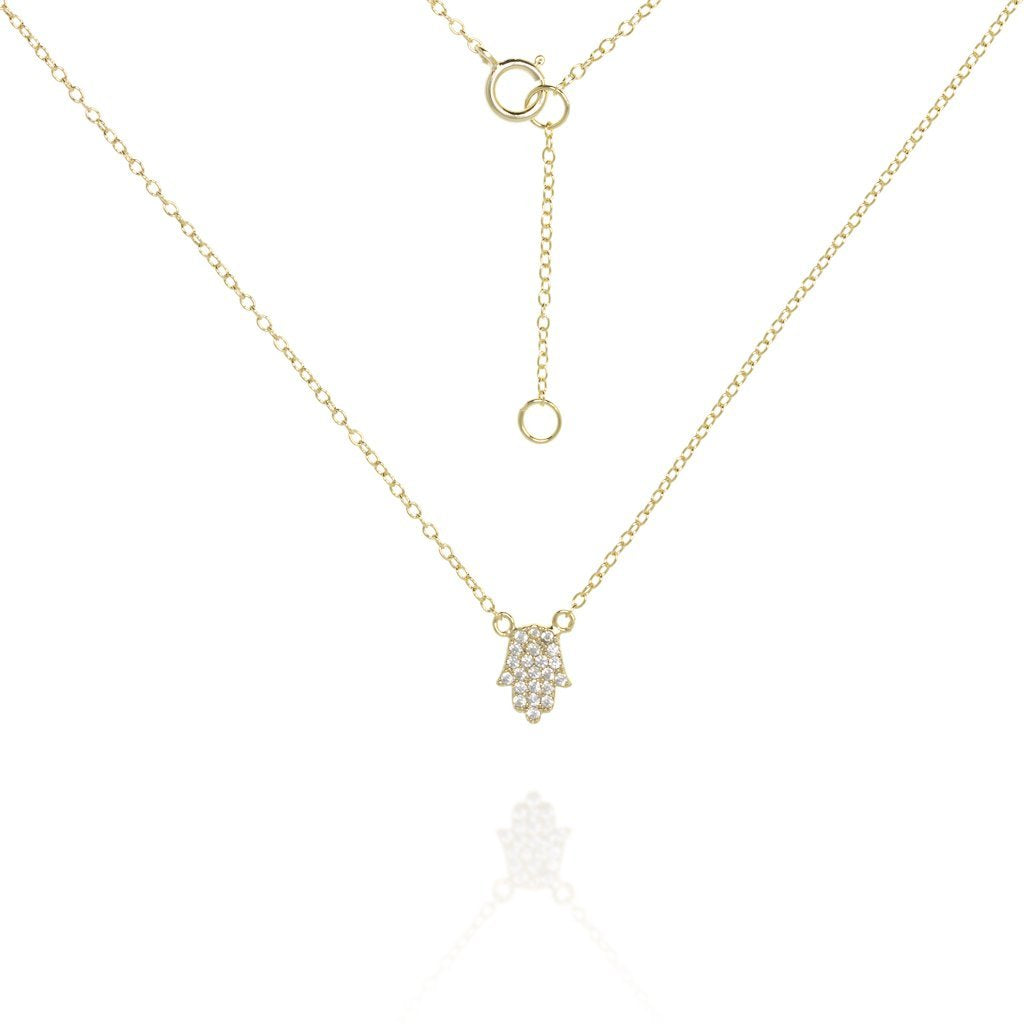 Gold chain and hamsa cubic zirconia pendant necklace.