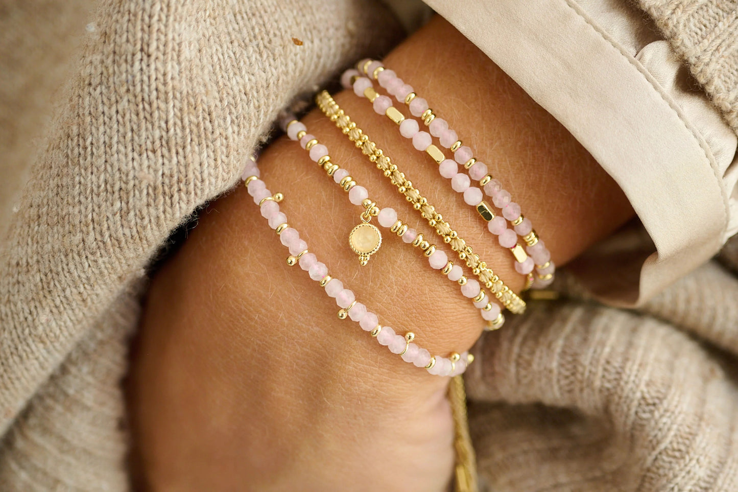 Morse Code Rose Quartz and Gold Bracelet stacked with other Rose Quartz Bracelets 